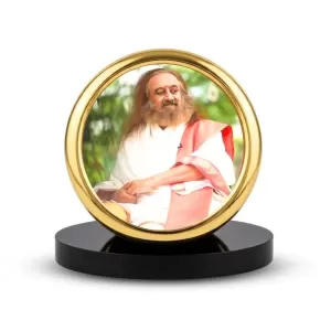 Car Desk/Table Top Sri Sri Ravi Shankar Metal Golden Photo Stand 2x2 Inches, Compact & Stylish Spiritual Display For Car, Home & Office (Pack Of 1) (F18574) Car Desk/Table Top Sri Sri Ravi Shankar Metal Golden Photo Stand 2x2 Inches, Compact & Stylish Spiritual Display For Car, Home & Office (Pack Of 1) (F18574)